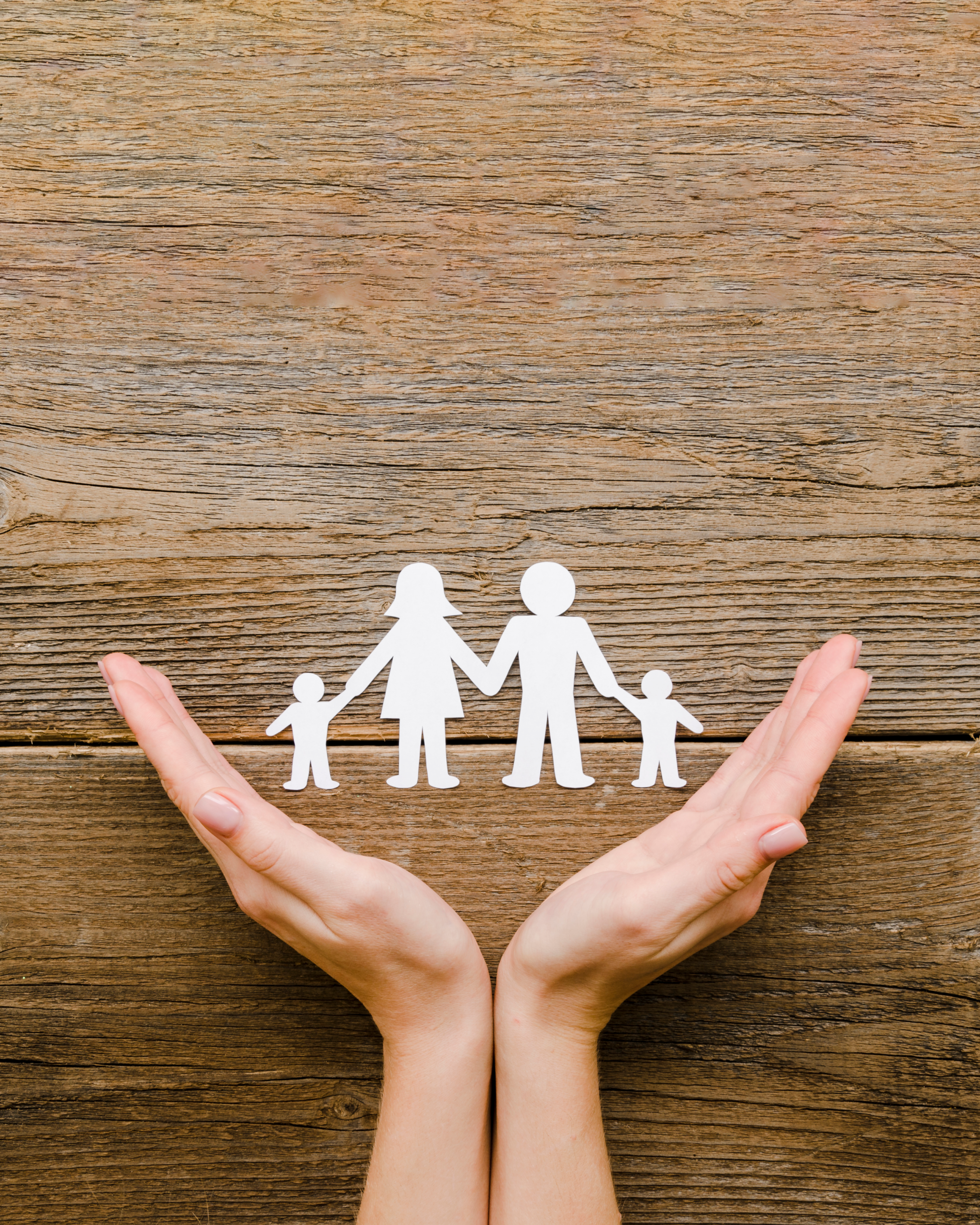 paper family composition wooden background with copy space 2.webp